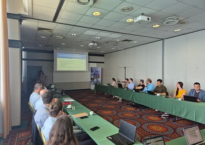 Inno2MARE project members seated around a conference table, actively participating in a working session during the June 2025 meeting.