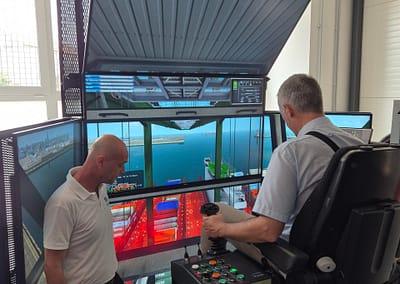 Side view of the Innovation Training Center with modern architecture and glass-panel design, surrounded by outdoor space.
